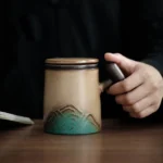 handcrafted 3d mountain relief ceramic tea infuser mug with built in filter