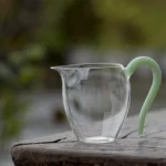 7.4oz mini glass gong dao bei with green mint handle tea pitcher front view
