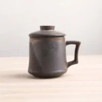 black gold handcrafted ceramic tea infuser mug with lid full view