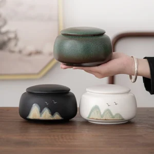 black hand painted landscape ceramic tea canister with lid removed showing seal pad