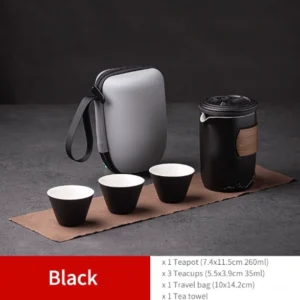 Black portable ceramic travel tea set with carrying bag open showing all components