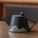 black variant handcrafted chinese mountain ceramic teapot with built-in filter