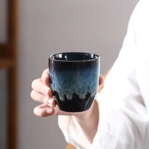 Handcrafted blue Jianzhan Chinese tea cup full view with unique kiln changed glaze