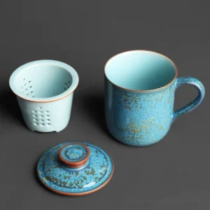 blue speckled ceramic tea mug with infuser and lid full product view