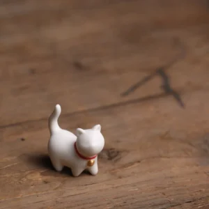 ceramic cat tea pet front view white with red collar golden bell