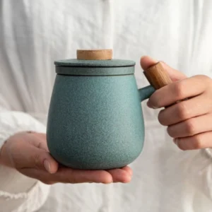 ceramic tea mug with infuser lid and wood handle full product view