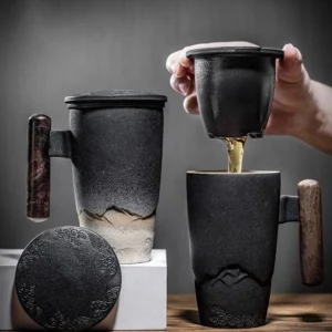 ceramic tea mug with strainer and wooden handle side view
