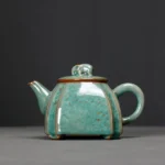 handmade-chinese-elephant-knob-green-ceramic-teapot-with-gold-speckles-main-view