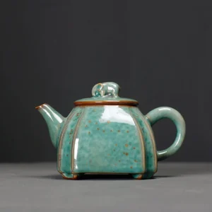 handmade-chinese-elephant-knob-green-ceramic-teapot-with-gold-speckles-main-view