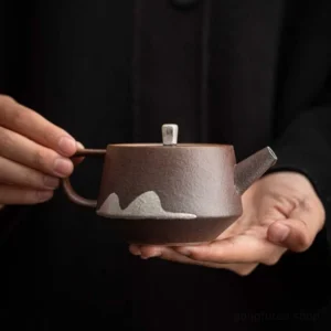 chinese faraway mountain ceramic teapot main view dark brown with white mountain pattern