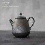 full side view of handmade chinese iron rust glaze ceramic teapot with built in infuser