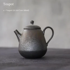 full side view of handmade chinese iron rust glaze ceramic teapot with built in infuser