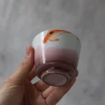 collection display of handcrafted chinese koi fish porcelain tea cup with different styles