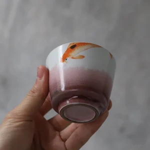 collection display of handcrafted chinese koi fish porcelain tea cup with different styles
