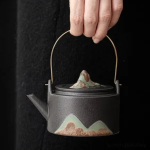 Chinese mountain handled ceramic teapot side view black variant