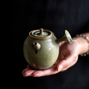 handcrafted chinese ceramic side handle teapot with ginkgo leaf decoration green retro