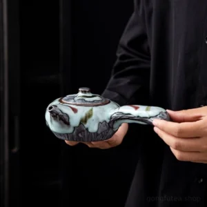side view of handmade chinese wabi-sabi ceramic side handle teapot