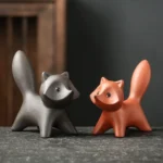 Handcrafted porous clay squirrel tea pet on wooden tea tray, main view
