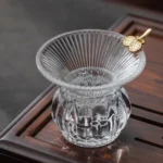 handcrafted clear glass tea strainer with lucky chinese coins decor main view