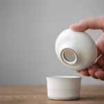 full set view of complete white ceramic gongfu tea set with ceramic tea strainer stainless steel filter