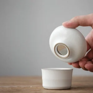 full set view of complete white ceramic gongfu tea set with ceramic tea strainer stainless steel filter