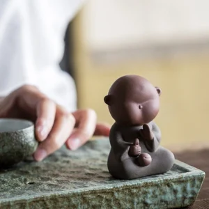 group display of multiple cute little monk ceramic tea pet zen decor
