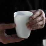 full view of Dehua mutton fat jade porcelain gong dao bei creamy white tea pitcher