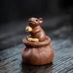 front view of handmade purple clay fortune mouse tea pet lucky gongfu tea decor