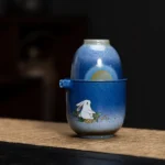 full set view of gradient blue ceramic travel tea set with jade rabbit moon pattern