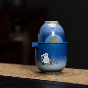 full set view of gradient blue ceramic travel tea set with jade rabbit moon pattern