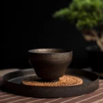 Collection of handmade gilded bronze Chinese tea cups in multiple sizes