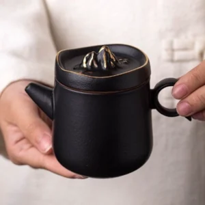 handmade gilded mountain top black chinese teapot front view