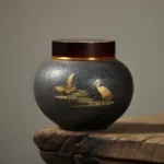 hand painted golden crane dark grey ceramic tea canister front view