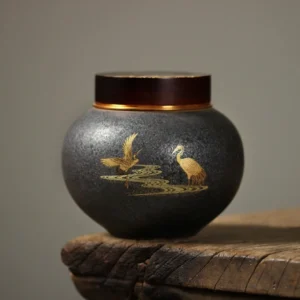 hand painted golden crane dark grey ceramic tea canister front view