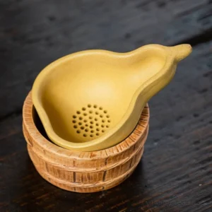 handcrafted gourd shape zisha tea strainer with matching holder full view