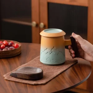gradient ceramic tea mug with infuser and lid with wood handle
