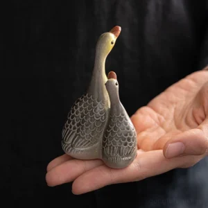 gray mother and baby goose color changing ceramic tea pet close up