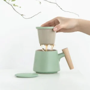 10.1oz green ceramic tea mug with strainer lid and wood handle main product view