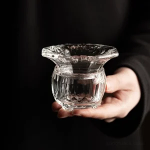 hand carved clear glass tea strainer with fish motif main view