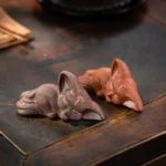 close up of hand carved sleeping fox tea pet clay figurine