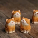 Set of 2 hand carved wooden cat tea pet front view