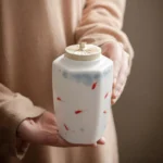 hand painted ceramic tea canister with fish motif ice crack glaze