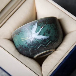 side view of hand painted lotus crane ceramic chawan tea cup