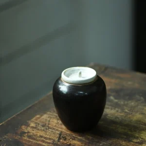 handcrafted black ceramic airtight loose leaf tea canister main product view