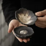 Handcrafted ceramic lotus tea strainer with matching stand, traditional Chinese tea accessory