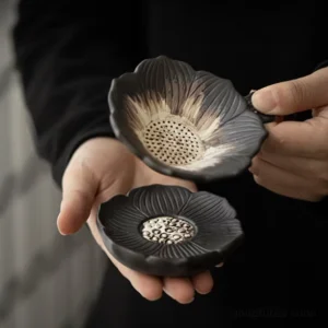 Handcrafted ceramic lotus tea strainer with matching stand, traditional Chinese tea accessory