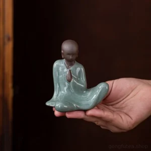 Handcrafted ceramic meditating little monk tea pet main view, celadon crackle glaze zen tea table decor
