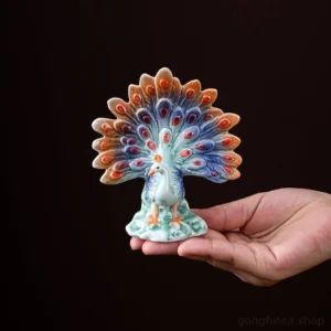 Full view of handcrafted ceramic peacock tea pet, Chinese tea pet decoration