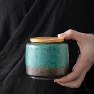 Hand held handcrafted ceramic tea canister with bamboo lid for loose tea storage