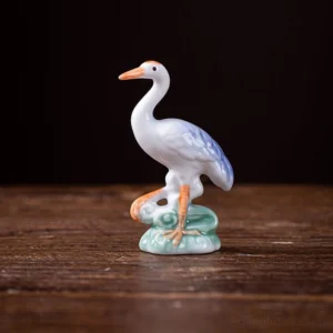 handcrafted ceramic white crane tea pet on tea table
